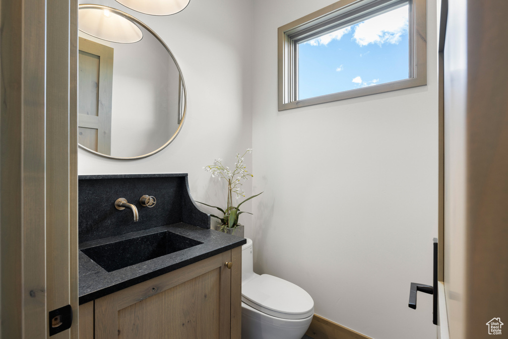 Bathroom featuring vanity and toilet