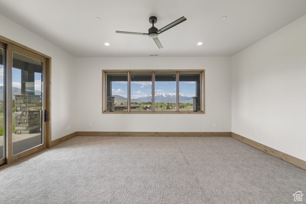 Empty room with recessed lighting, baseboards, ceiling fan, and carpet floors