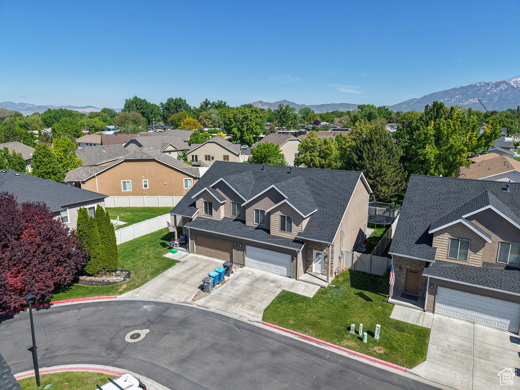 Aerial view of residential area with a mountainous background