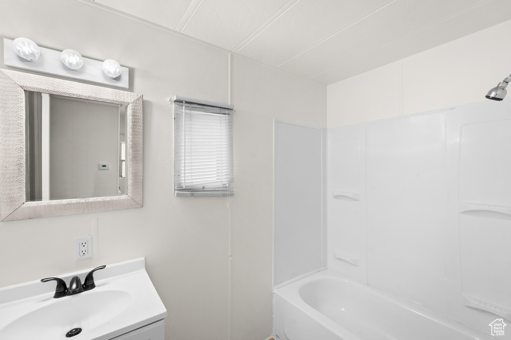 Full bath featuring vanity and bathtub / shower combination