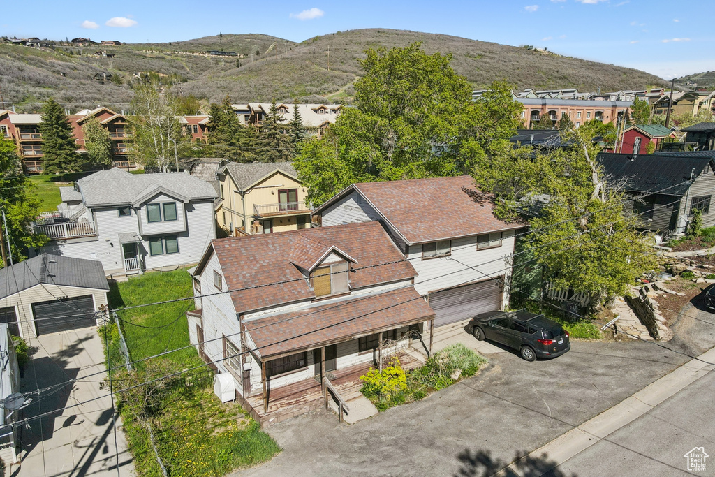 Aerial perspective of suburban area with a mountain backdrop