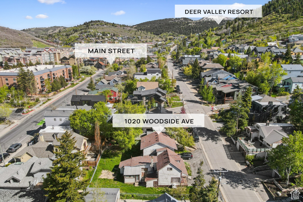 Aerial view of residential area featuring a mountain backdrop