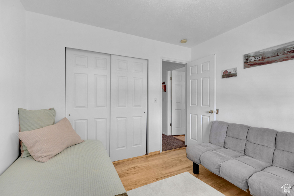 Bedroom featuring a closet and light wood-type flooring