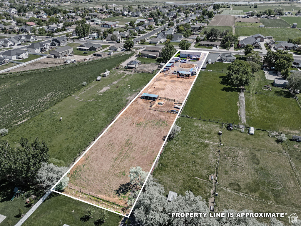 Aerial view of property and surrounding area featuring property boundaries highlighted