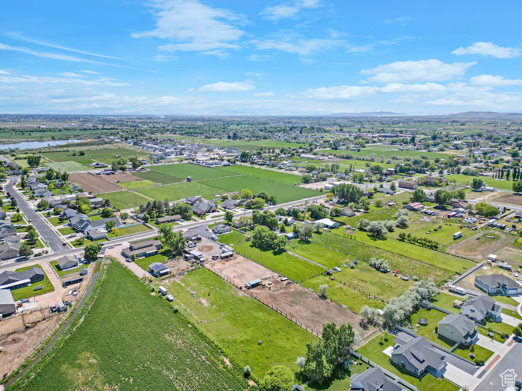 Aerial perspective of suburban area featuring a nearby body of water