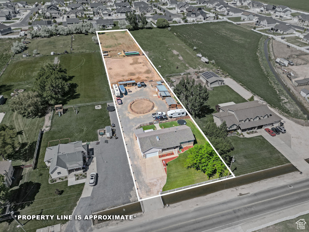 Aerial perspective of suburban area featuring property boundaries highlighted