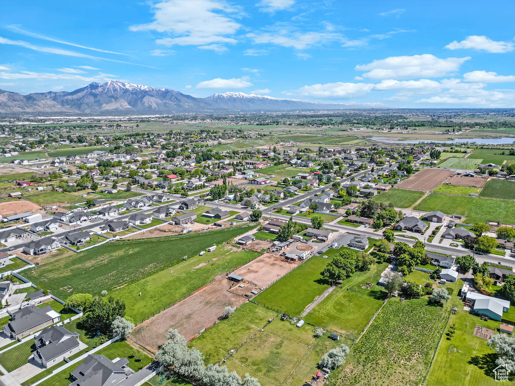 View of property location featuring a mountain backdrop and nearby suburban area