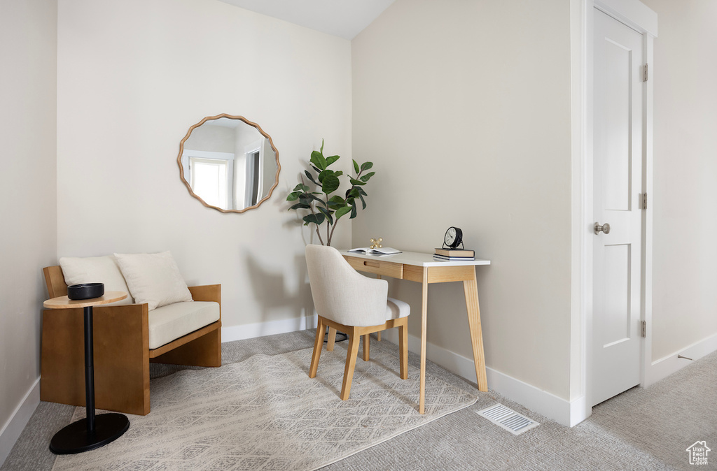 Office area with light carpet and baseboards