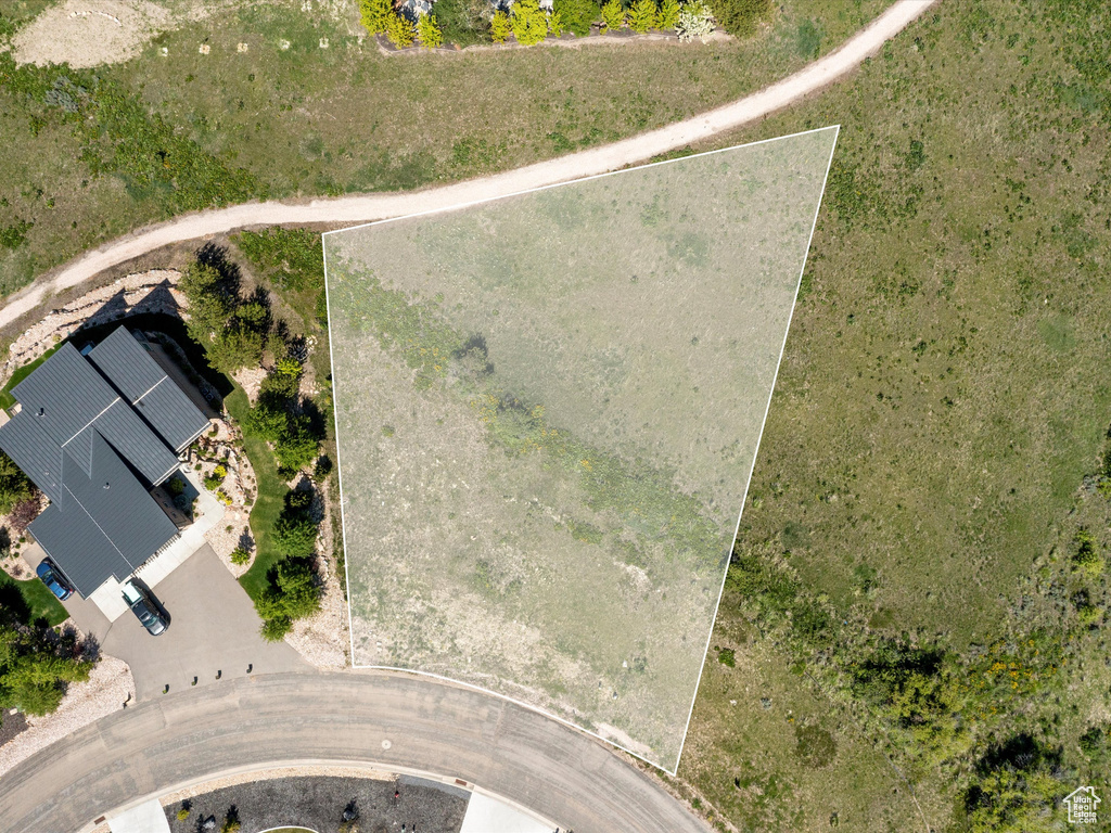 Aerial view of property and surrounding area featuring property parcel outlined