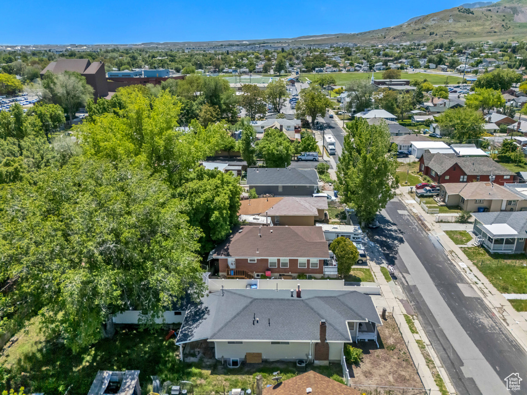 Aerial perspective of suburban area featuring a mountainous background