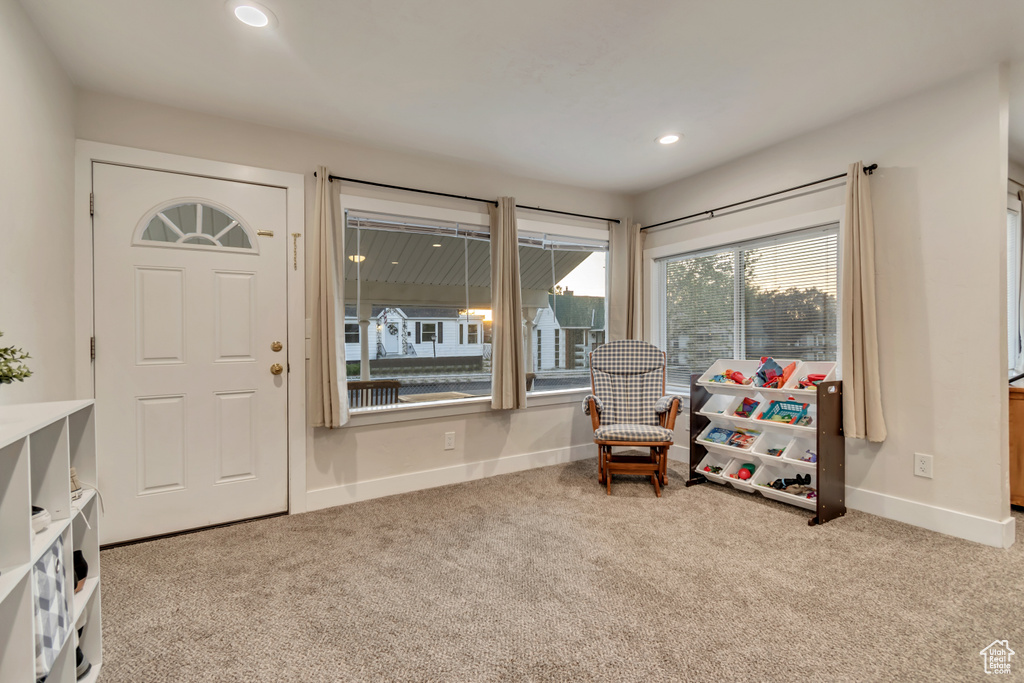 Sitting room with carpet floors, baseboards, and recessed lighting