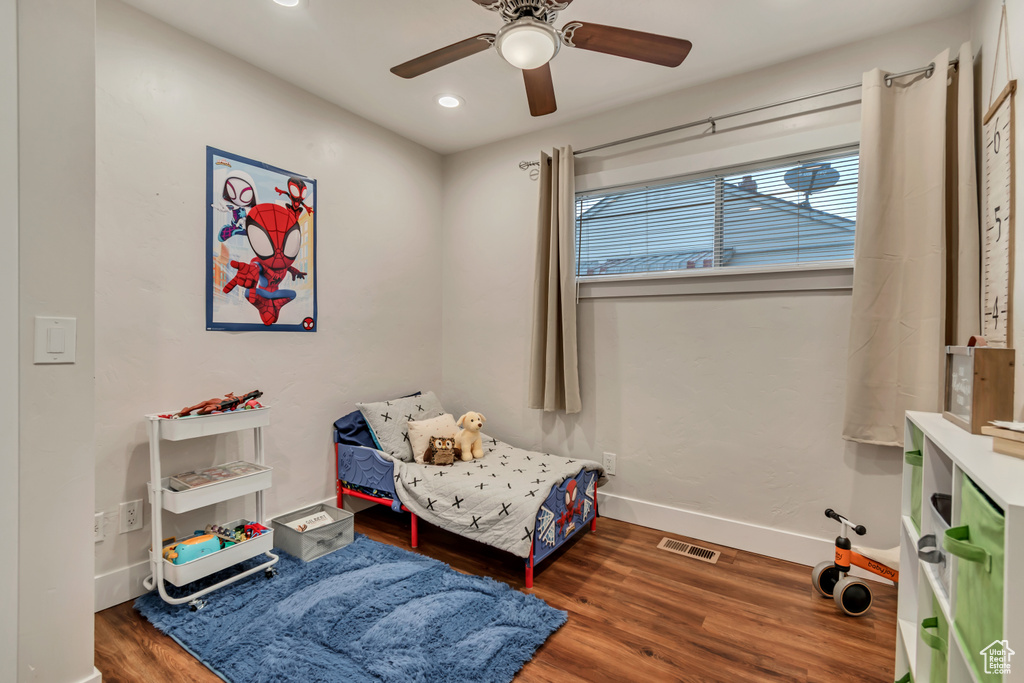 Bedroom featuring wood finished floors, recessed lighting, baseboards, and ceiling fan