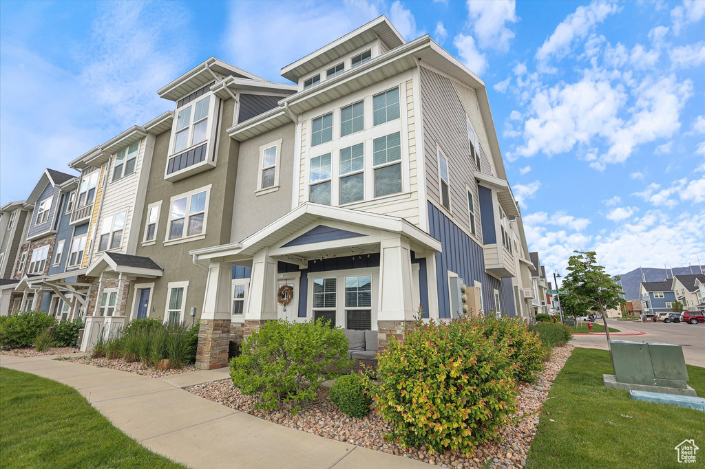 View of front of house featuring a residential view and stone siding