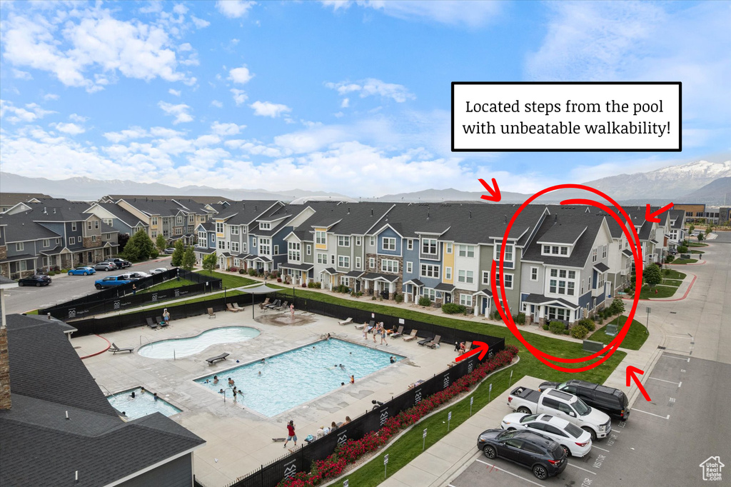 Community pool featuring a mountain view and a residential view