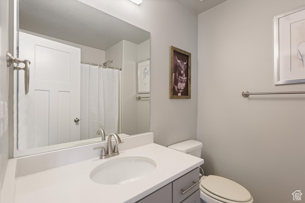 Bathroom with vanity and toilet