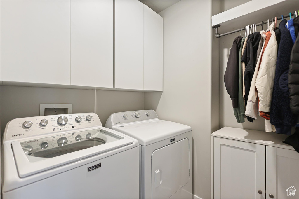 Laundry area with washer and dryer and cabinet space