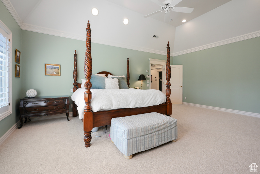 Carpeted bedroom featuring vaulted ceiling, baseboards, recessed lighting, ceiling fan, and crown molding