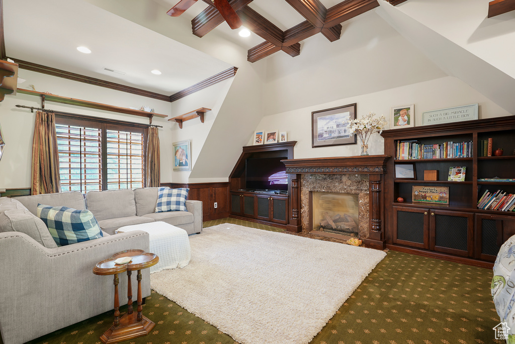 Carpeted living room featuring beam ceiling, crown molding, a wainscoted wall, coffered ceiling, and recessed lighting