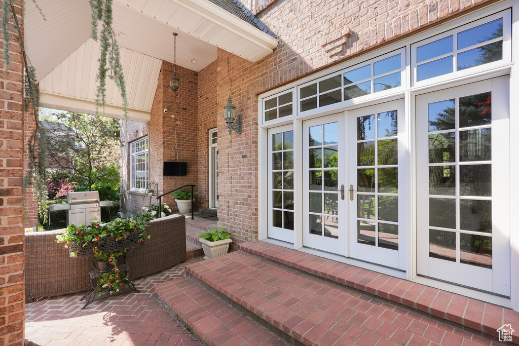 View of patio featuring french doors and area for grilling