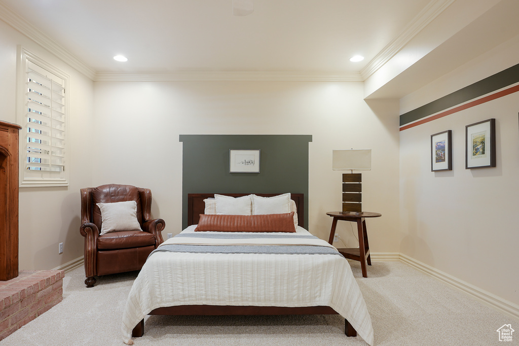 Carpeted bedroom with ornamental molding, recessed lighting, and baseboards