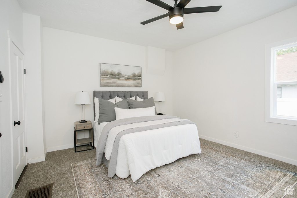 Bedroom with baseboards and ceiling fan