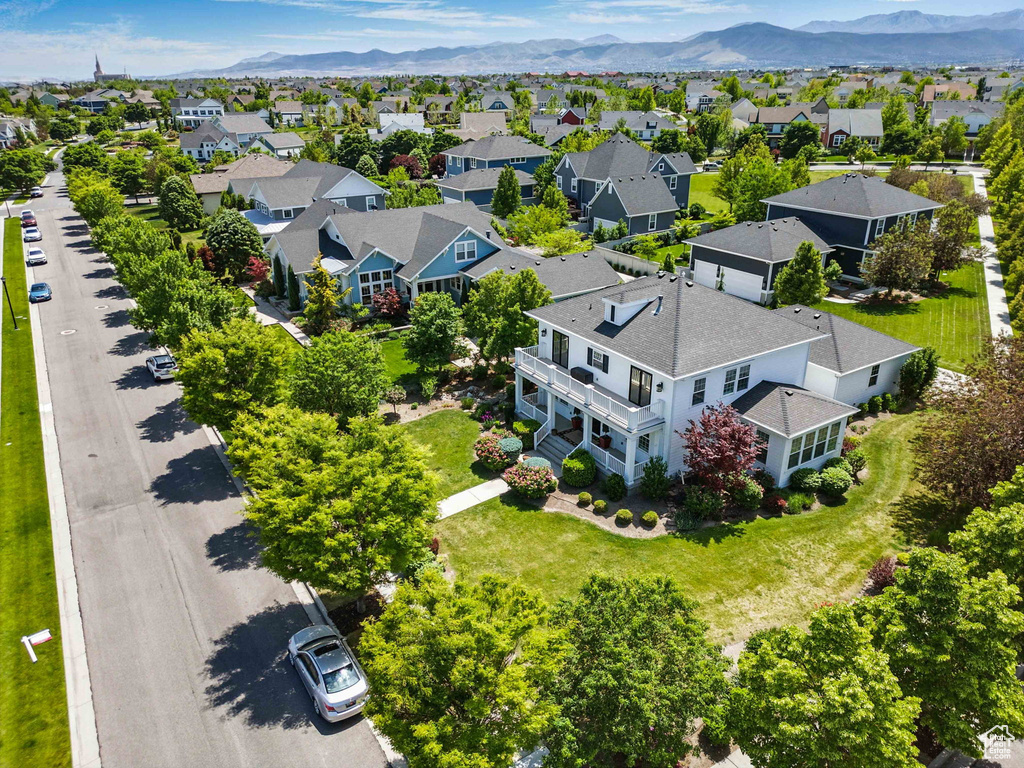 Aerial perspective of suburban area with a mountainous background