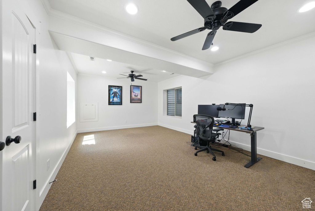 Unfurnished office featuring carpet flooring, crown molding, a ceiling fan, recessed lighting, and baseboards