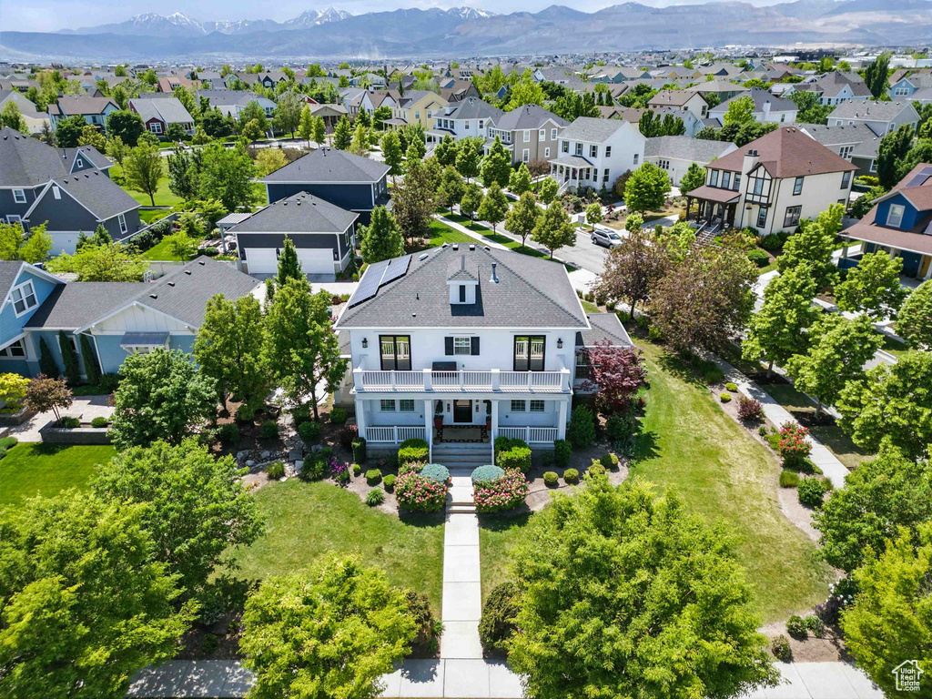 Aerial view of residential area featuring a mountain backdrop