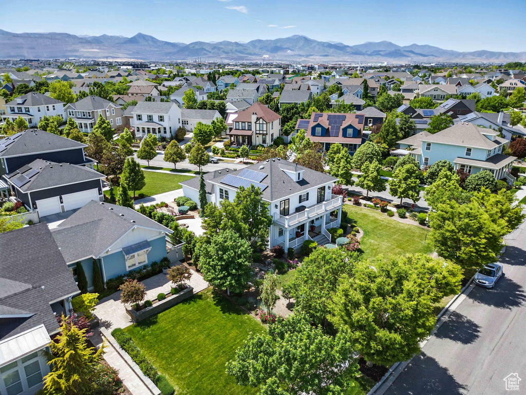 Aerial perspective of suburban area featuring a mountainous background