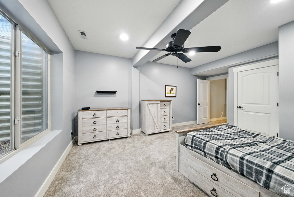 Bedroom featuring carpet flooring, baseboards, and a ceiling fan