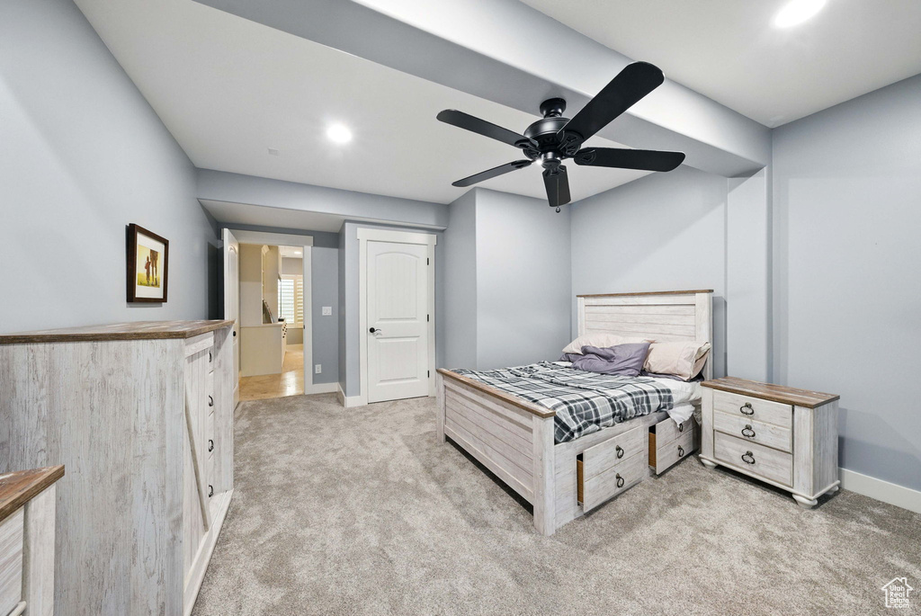 Bedroom featuring light carpet, baseboards, recessed lighting, and a ceiling fan