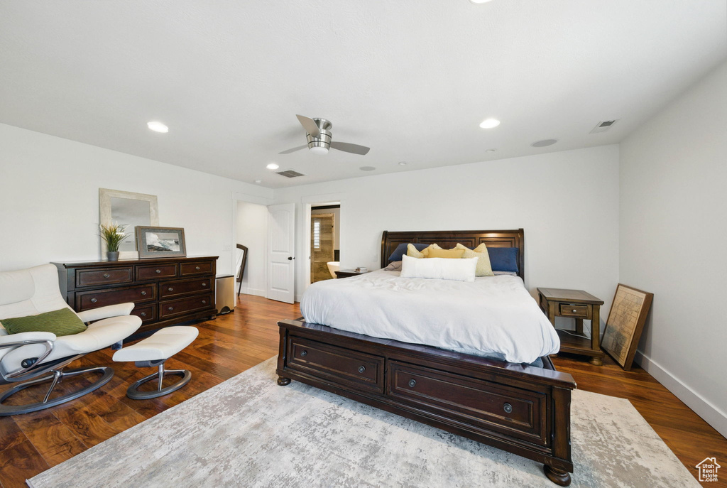 Bedroom with wood finished floors, baseboards, a ceiling fan, and recessed lighting