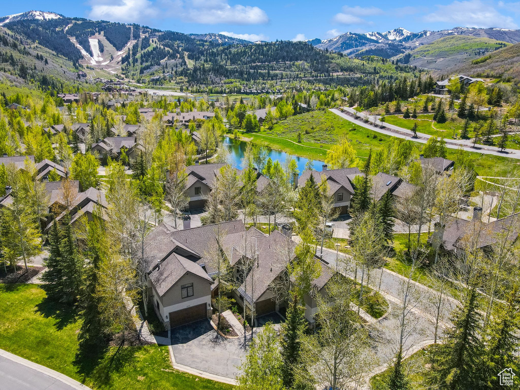 Aerial view of residential area featuring a water and mountain view