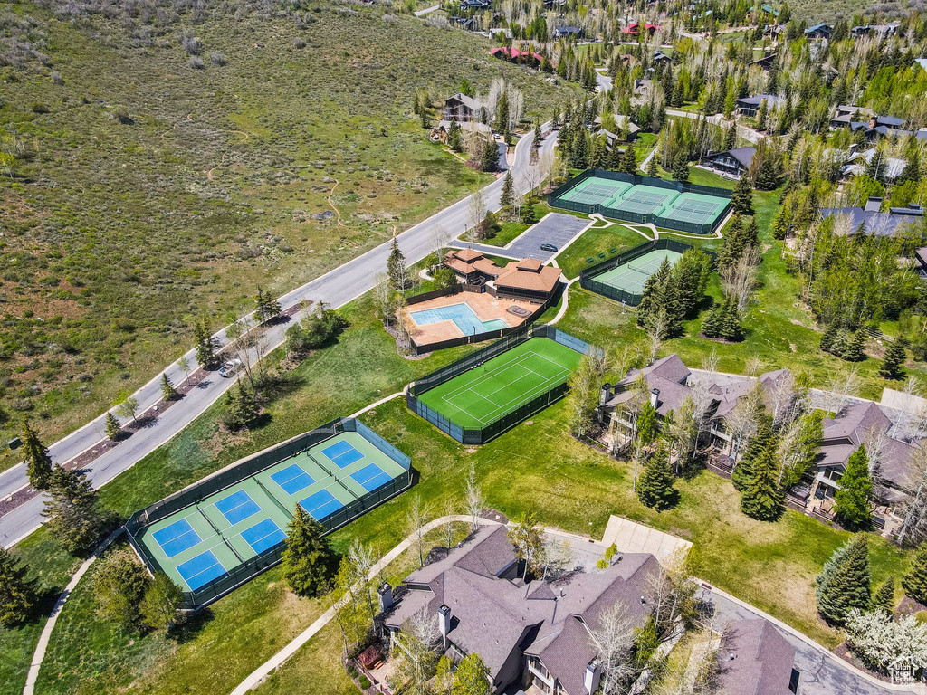 Aerial view of residential area featuring a pool area