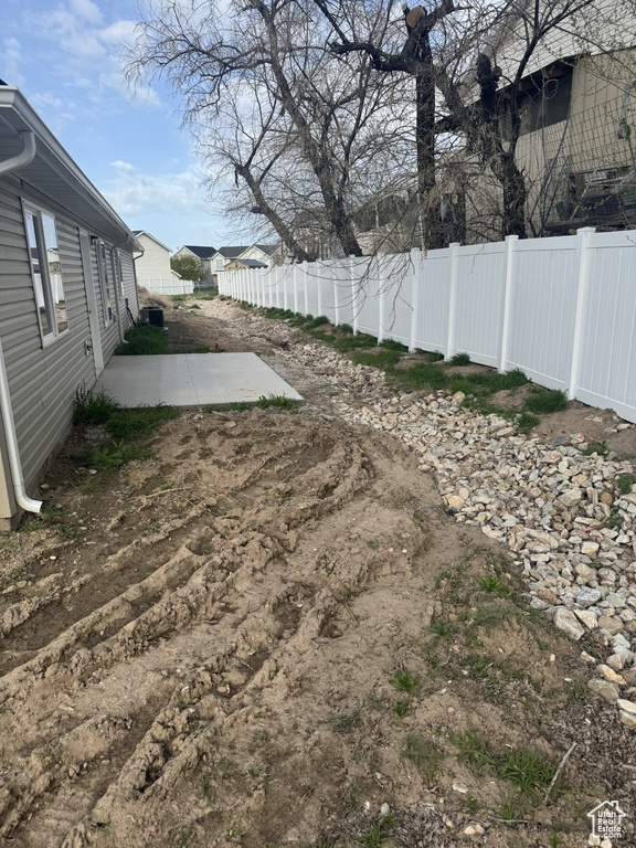 Fenced backyard featuring a patio area