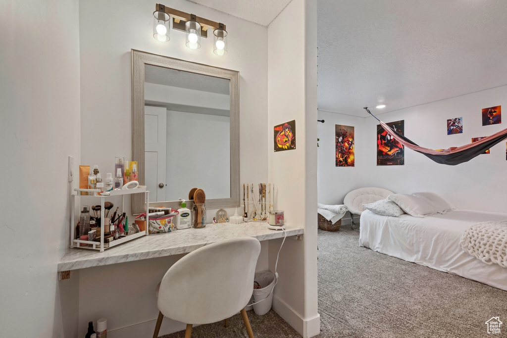Bedroom with carpet and baseboards