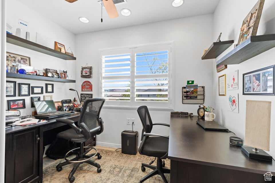 Office space featuring ceiling fan, baseboards, and recessed lighting