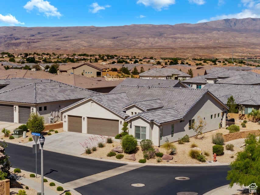 Aerial view of residential area with a mountainous background
