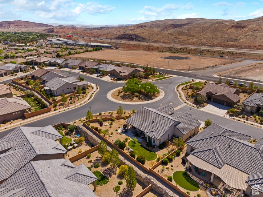 Aerial perspective of suburban area featuring a mountain backdrop