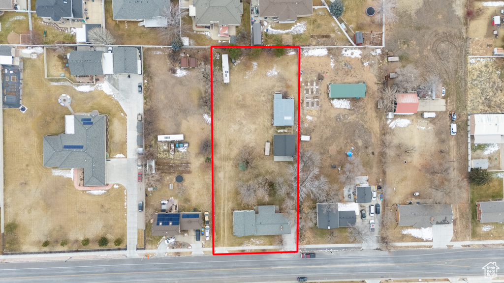 Aerial view of residential area with property parcel outlined