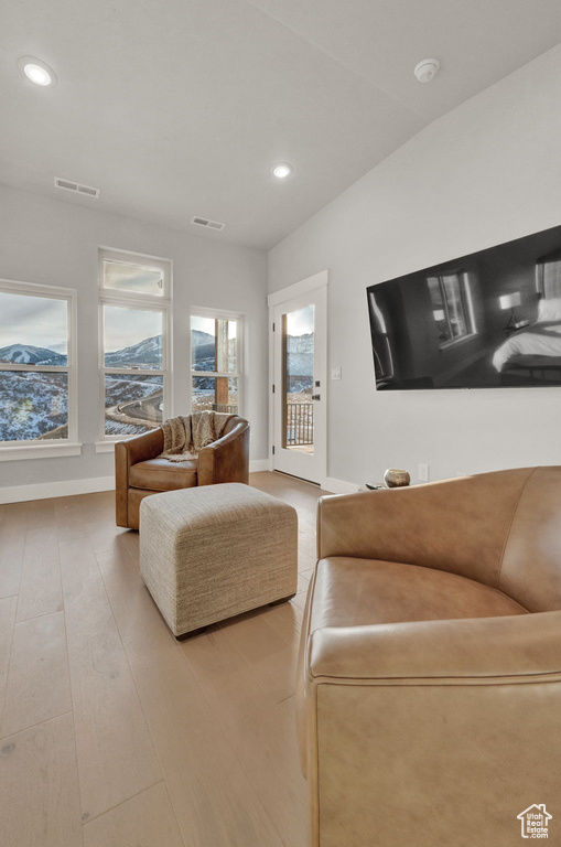 Living room featuring recessed lighting, baseboards, and wood finished floors