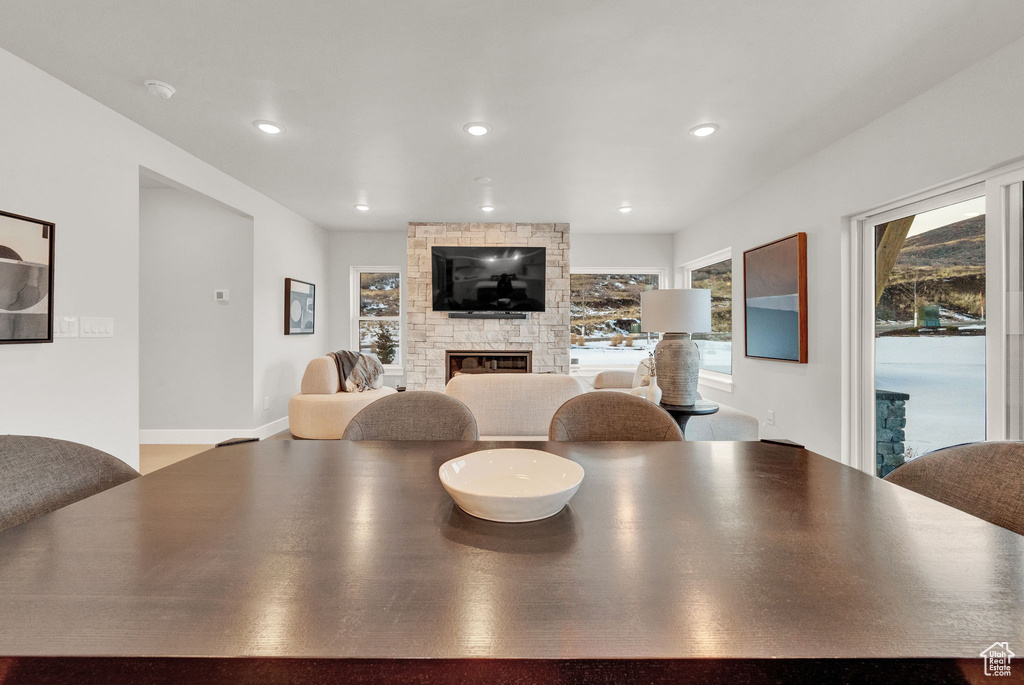 Dining space featuring a fireplace and recessed lighting