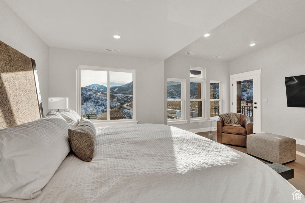 Bedroom featuring baseboards, wood finished floors, and recessed lighting