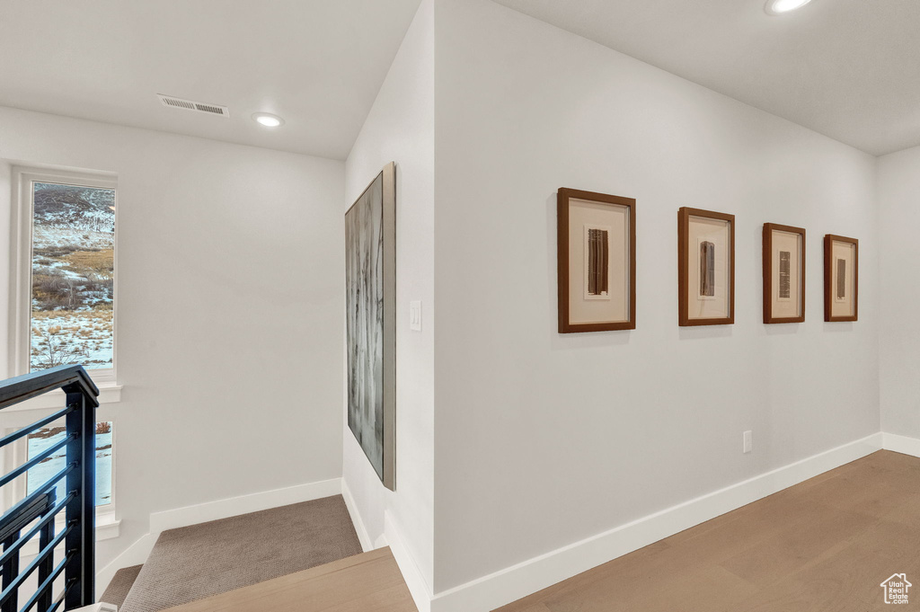 Hallway featuring baseboards and recessed lighting