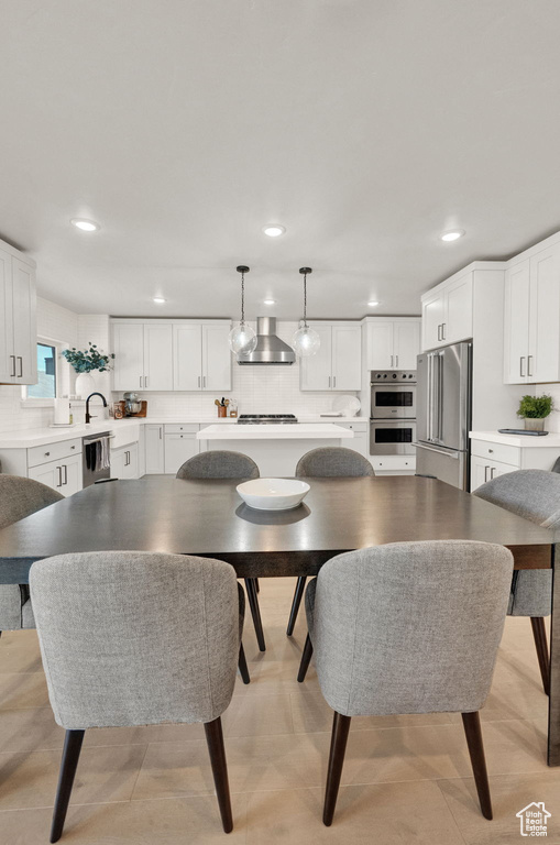 Dining space featuring recessed lighting