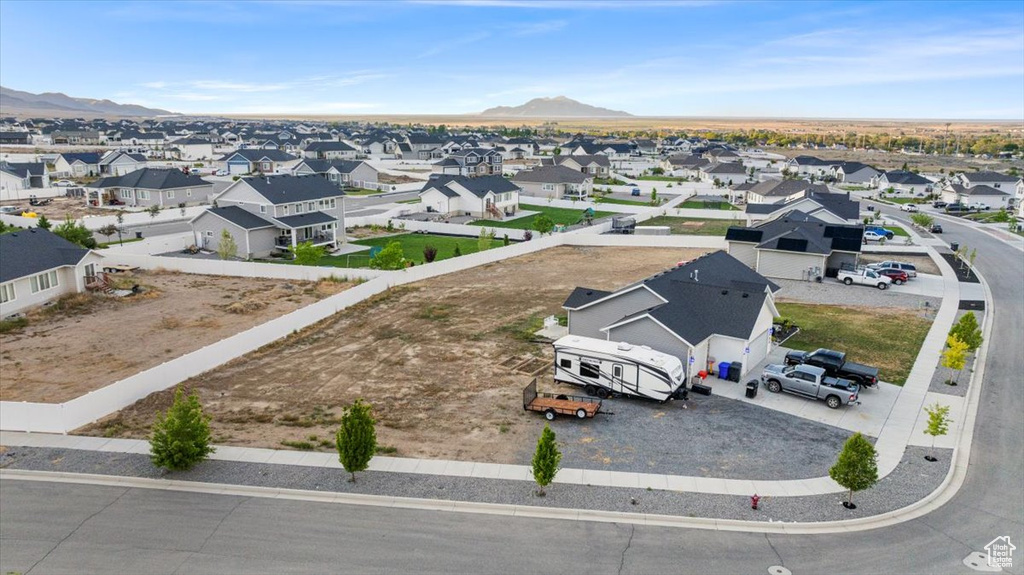 Aerial perspective of suburban area featuring a mountainous background