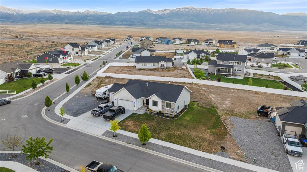 Aerial view of residential area with a mountainous background