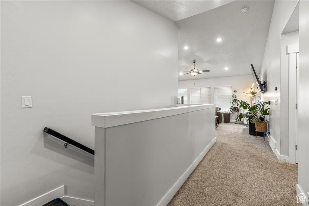 Corridor featuring an upstairs landing, carpet floors, recessed lighting, and baseboards