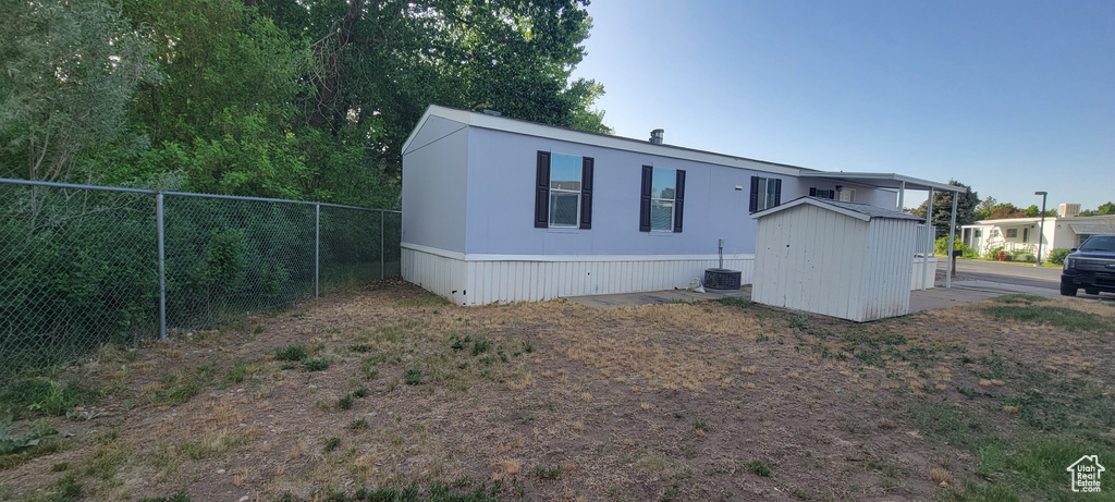 View of front of property with central air condition unit