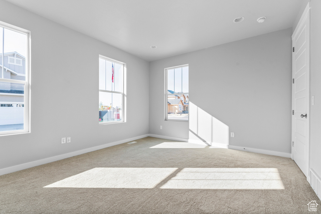 Unfurnished bedroom with carpet and baseboards